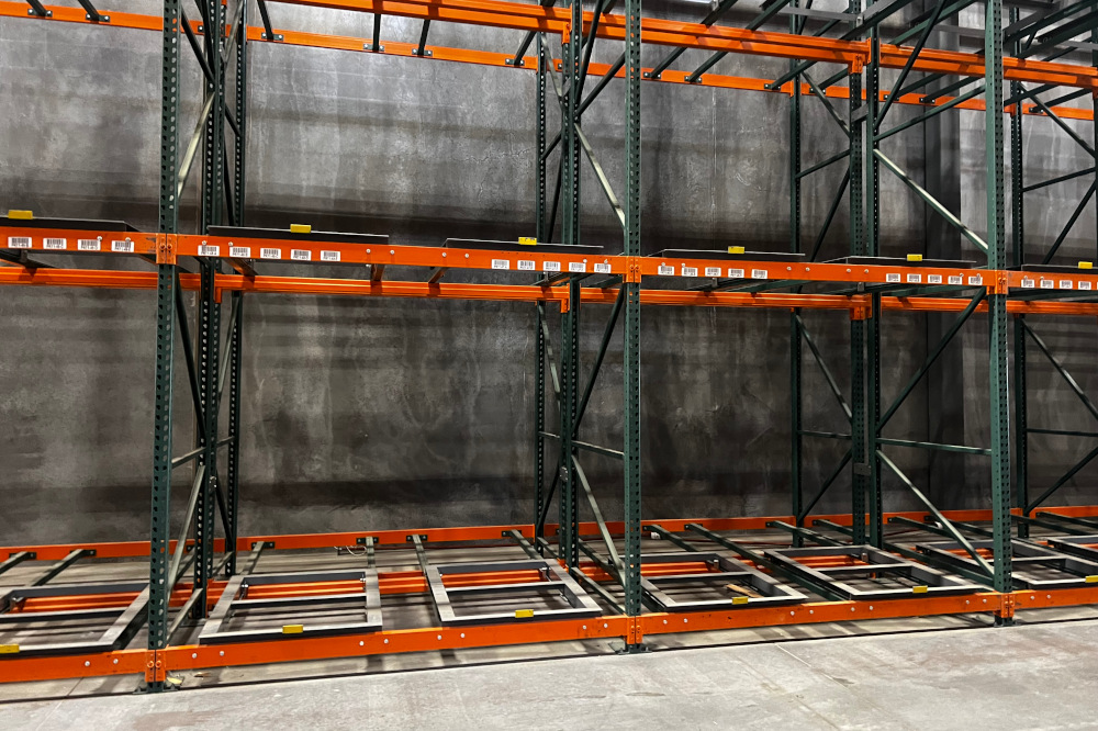 Push back pallet rack system loaded several pallets deep